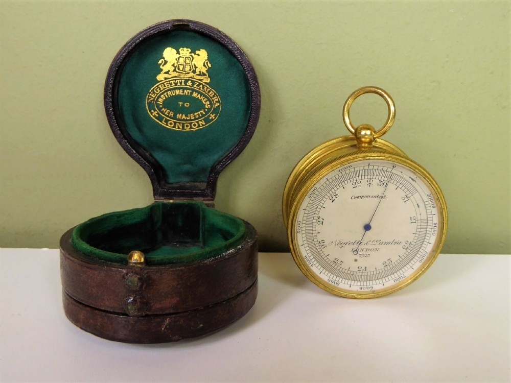 A 19thC. POCKET BAROMETER AND COMPASS