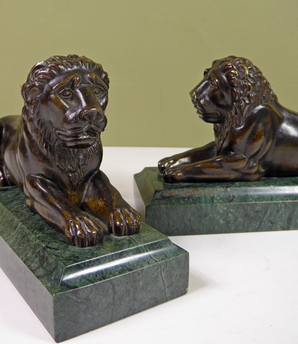 PAIR OF REGENCY BRONZE LIONS