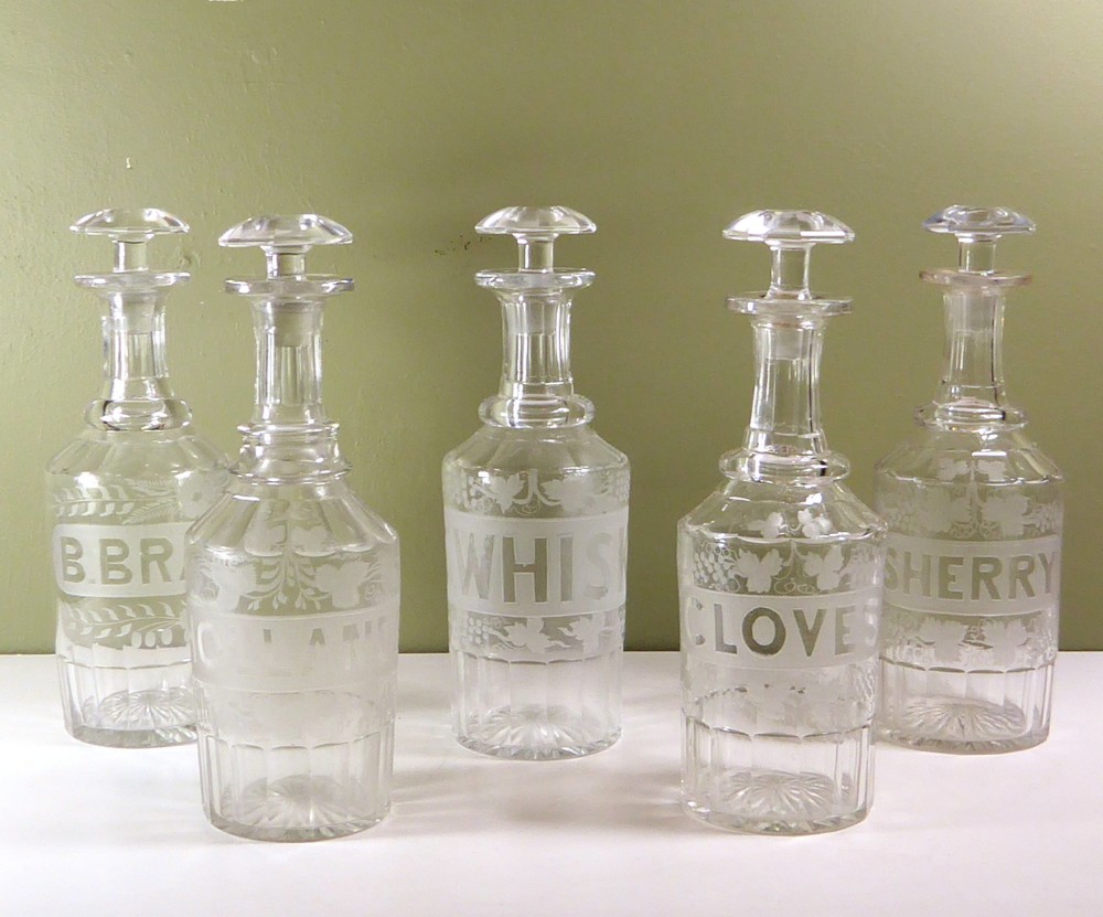 SET OF FIVE ENGRAVE DECANTERS