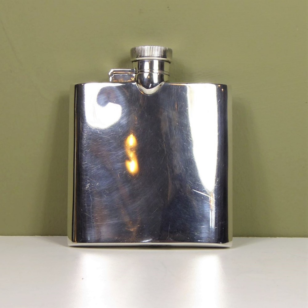 A SILVER HIP FLASK 