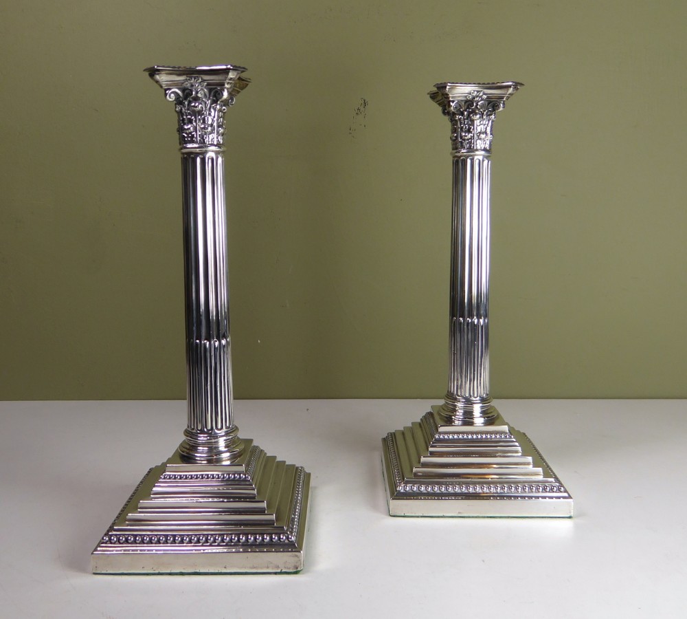 PAIR OF SILVER CORINTHIAN COLUMN CANDLESTICKS