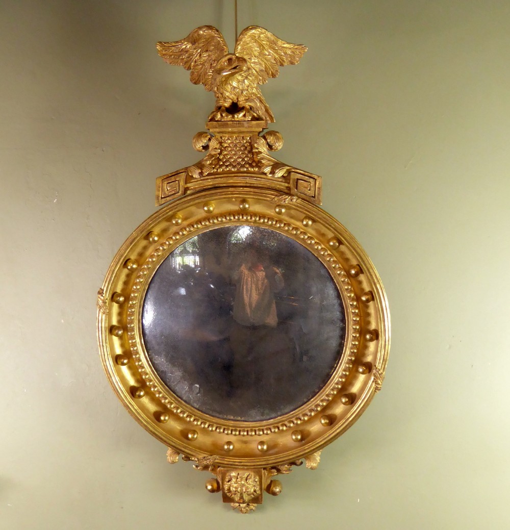 REGENCY GILT CONVEX MIRROR WITH EAGLE PEDIMENT