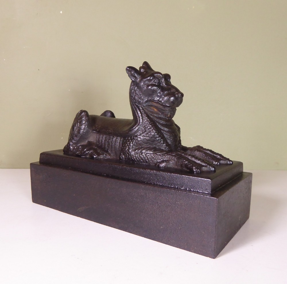 19TH C CAST IRON GRIFFIN DOOR PORTER
