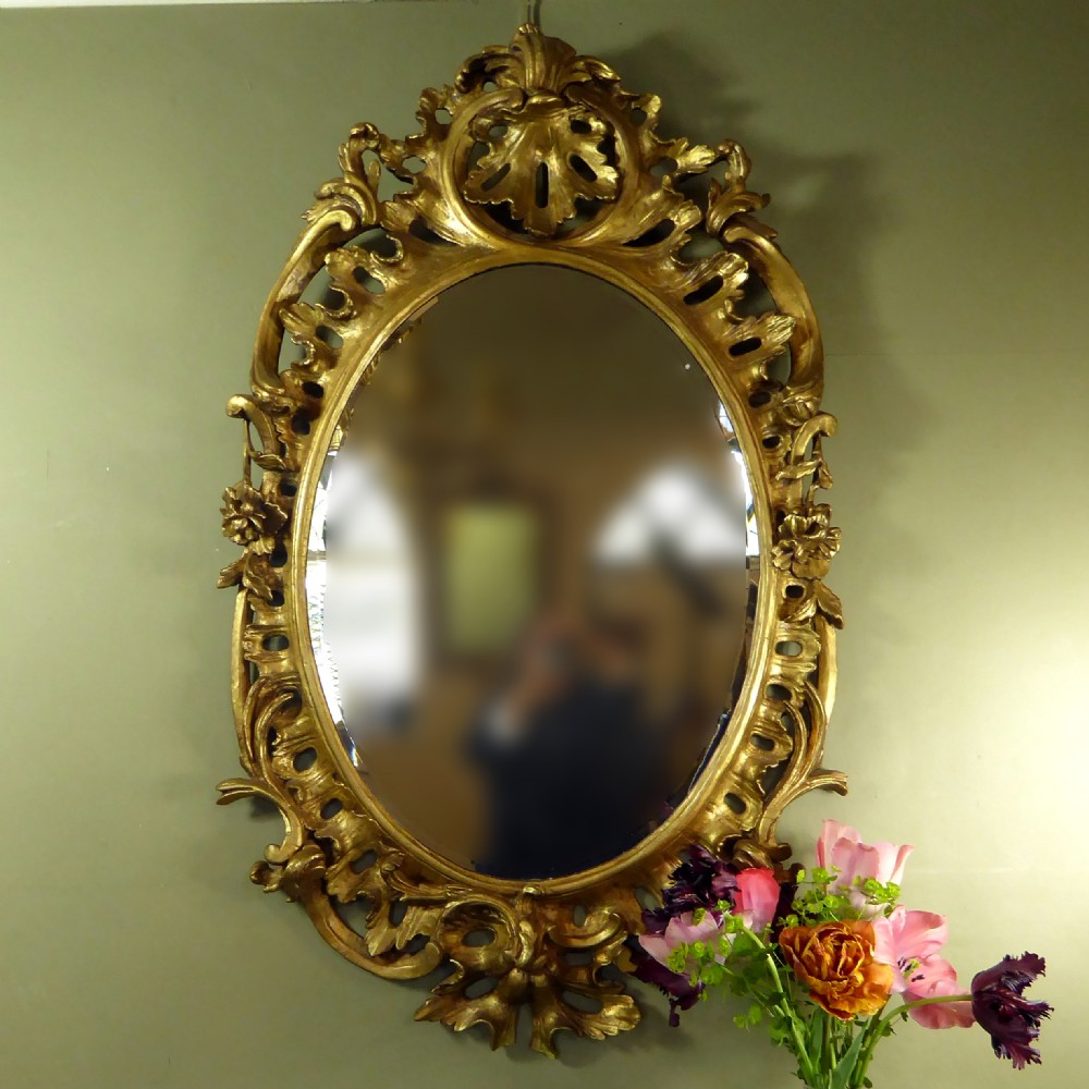 A LARGE GEORGE III GILT MIRROR