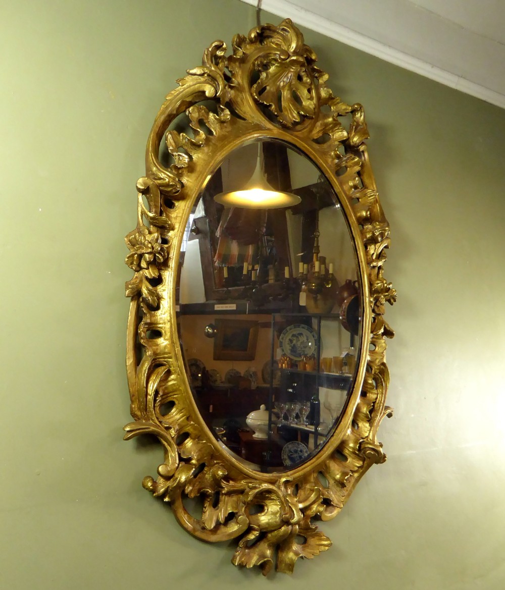 A LARGE GEORGE III GILT MIRROR View V