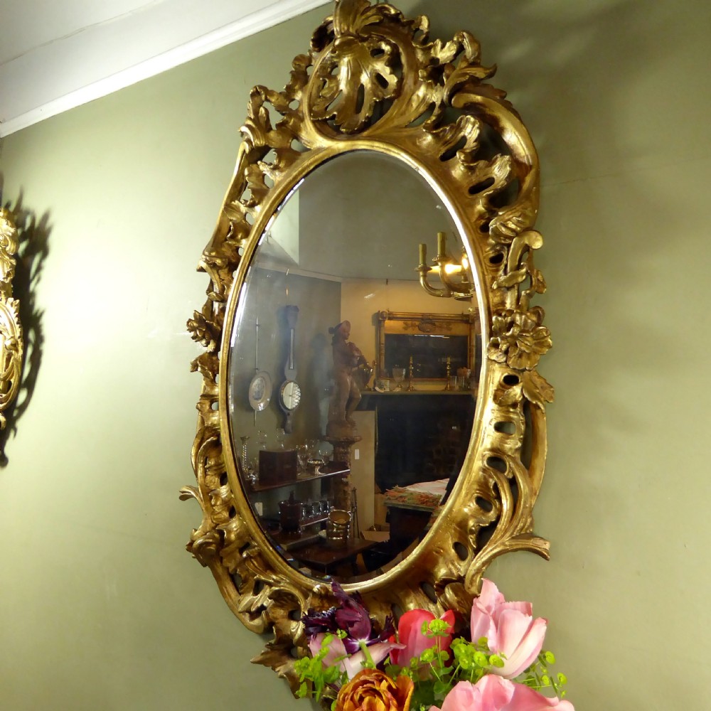A LARGE GEORGE III GILT MIRROR View VI