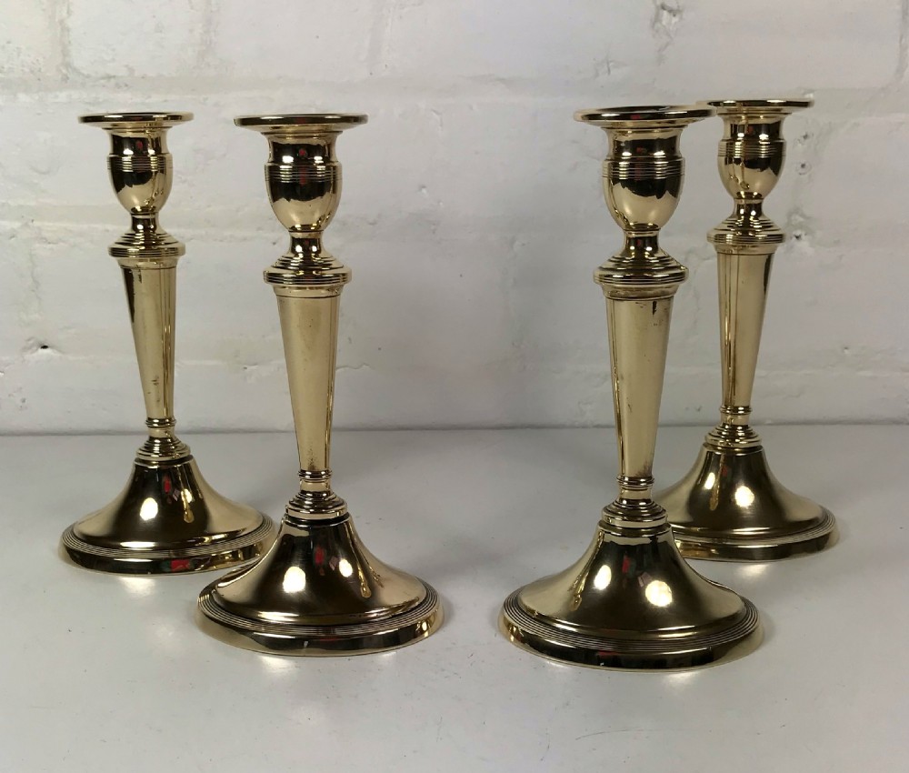 SET OF FOUR 18TH C CANDLESTICKS BY WILLIAM HARRISON
