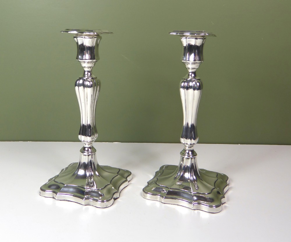A PAIR OF SILVER CANDLESTICKS View V