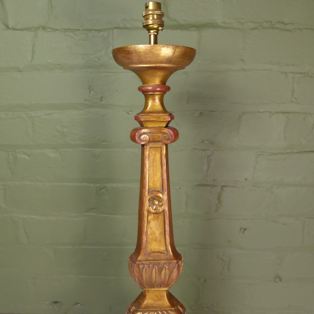 A tall 19th-century carved giltwood pricket candlestick converted into a table lamp base with a brass electrical fitting. View III