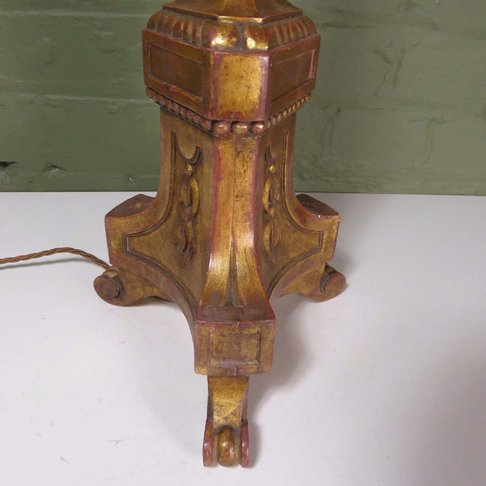 A tall 19th-century carved giltwood pricket candlestick converted into a table lamp base with a brass electrical fitting. View VI