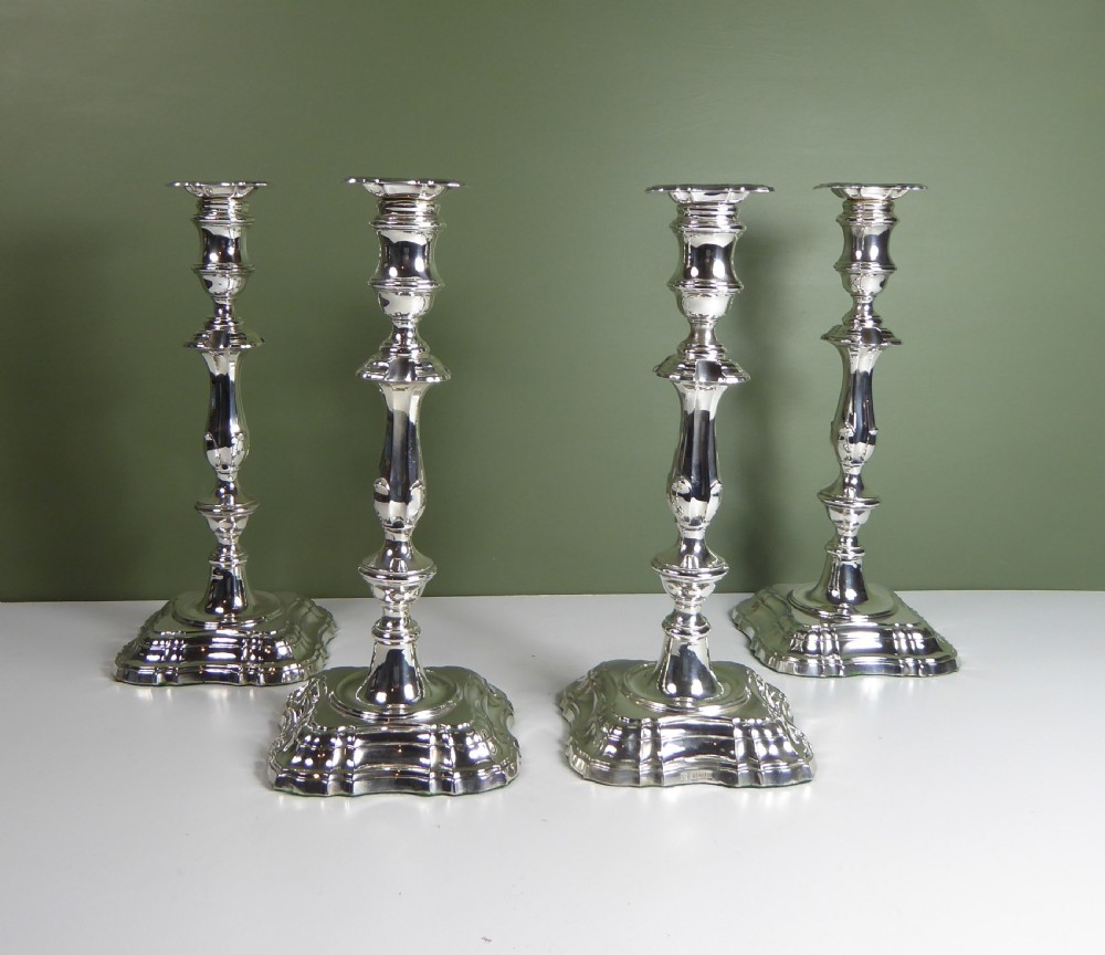 SET OF FOUR LARGE SILVER CANDLESTICKS