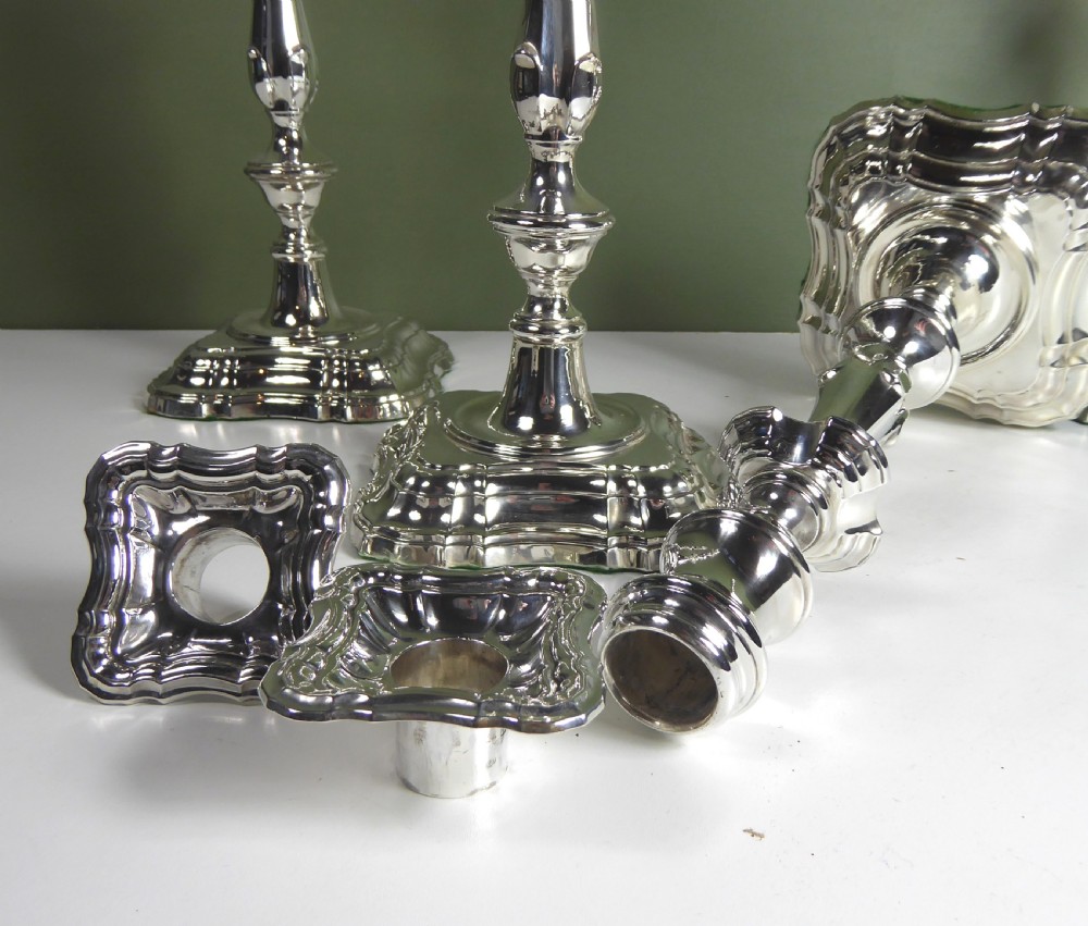 SET OF FOUR LARGE SILVER CANDLESTICKS View II