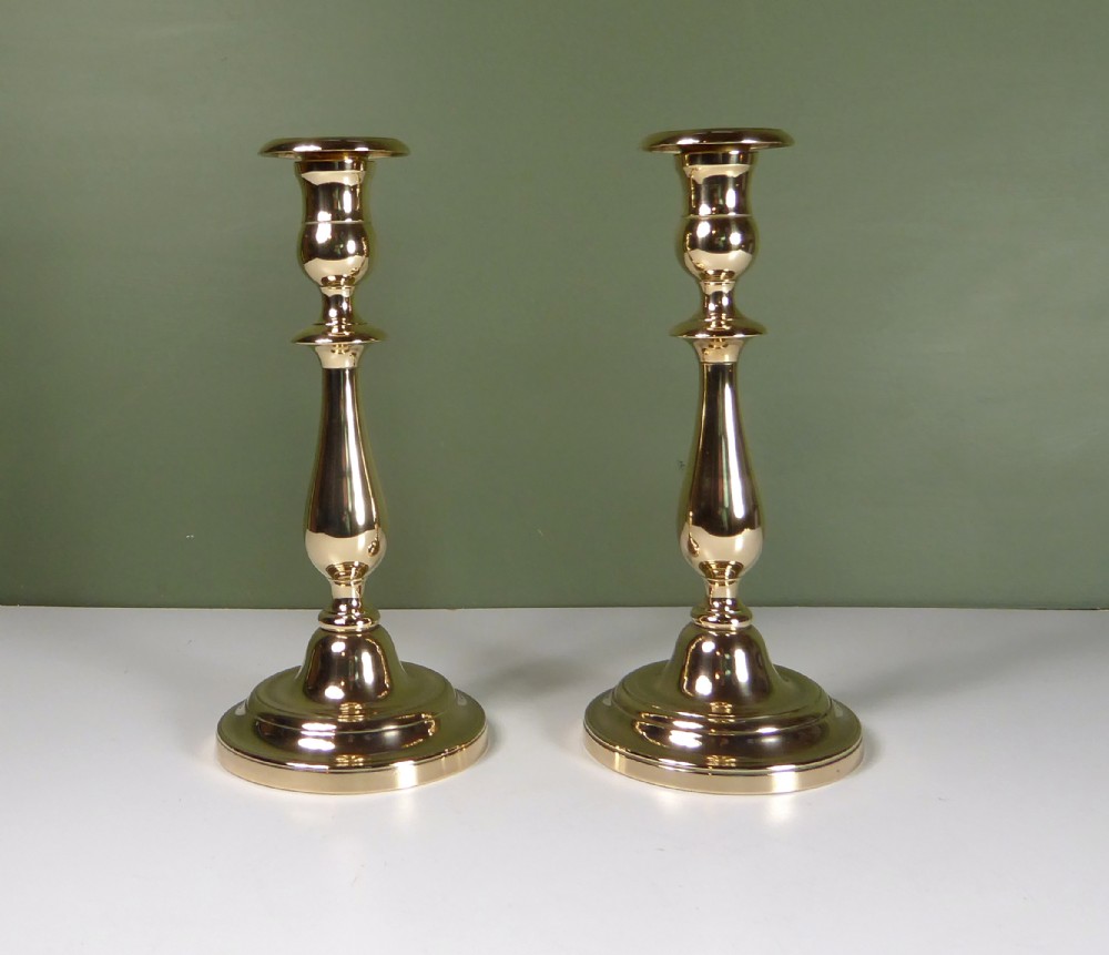 PAIR OF 19TH C BELL METAL CANDLESTICKS