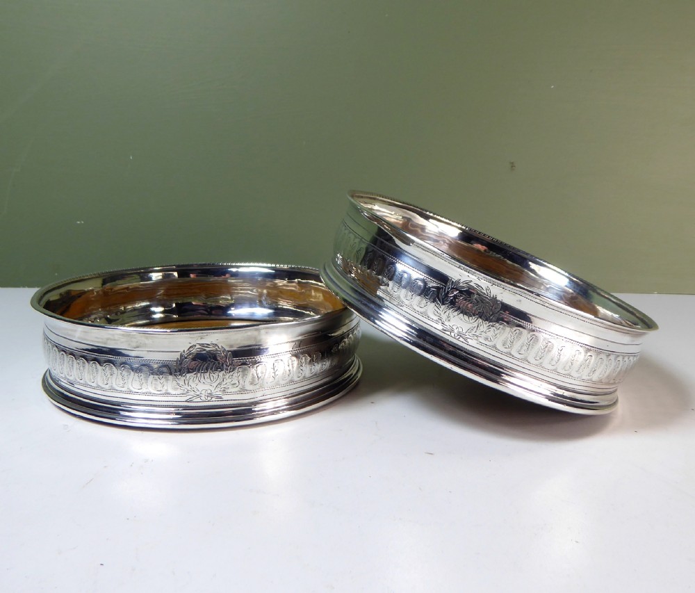 PAIR OF SILVER BOTTLE, DECANTER COASTERS