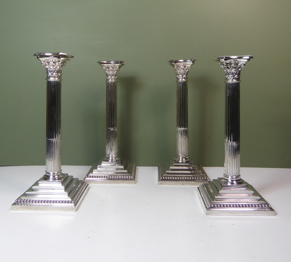 SET OF FOUR 19TH C SILVERPLATED CANDESTICKS