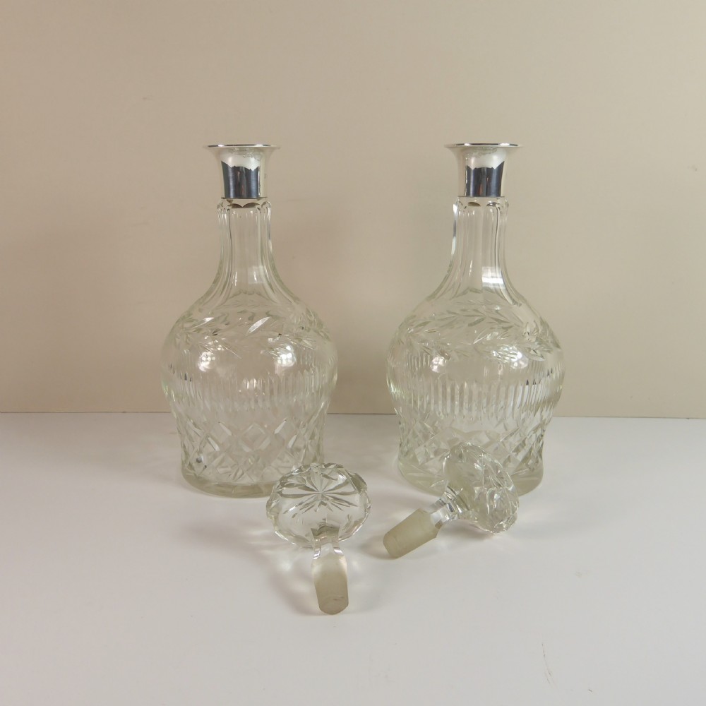 PAIR OF CUT GLASS DECANTERS WITH SILVER COLLARS View III