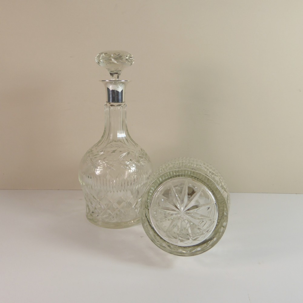 PAIR OF CUT GLASS DECANTERS WITH SILVER COLLARS View IV