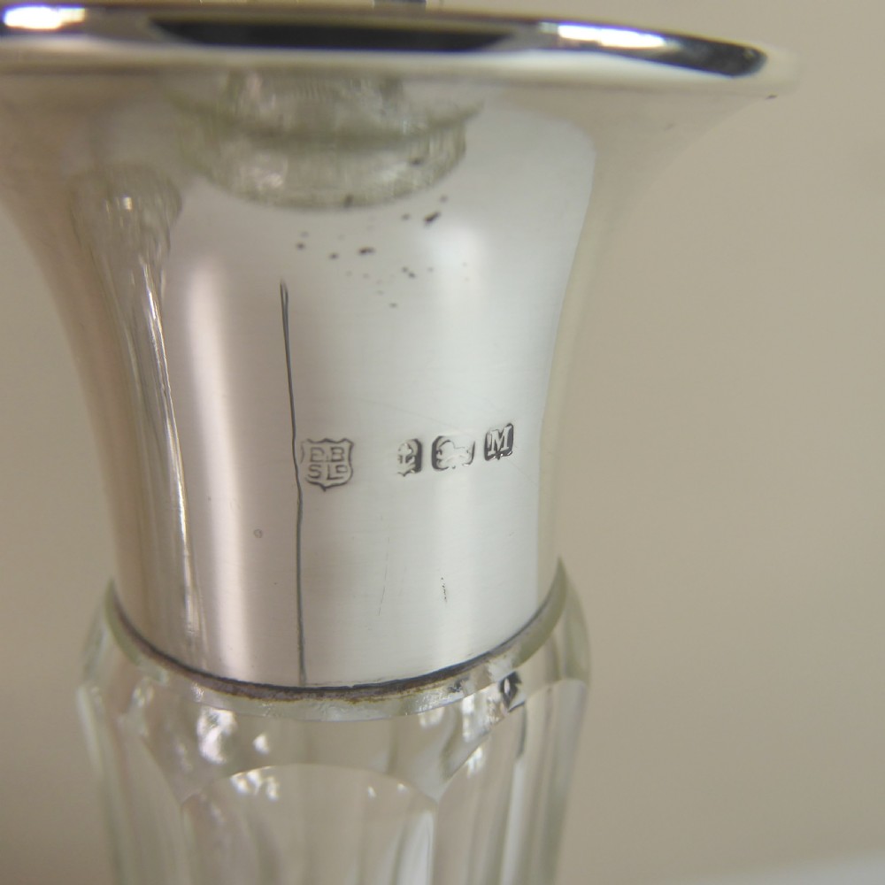 PAIR OF CUT GLASS DECANTERS WITH SILVER COLLARS View V