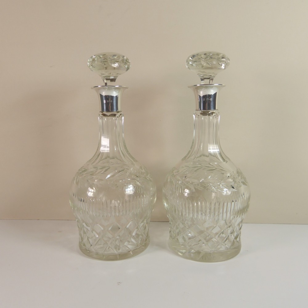 PAIR OF CUT GLASS DECANTERS WITH SILVER COLLARS View VI