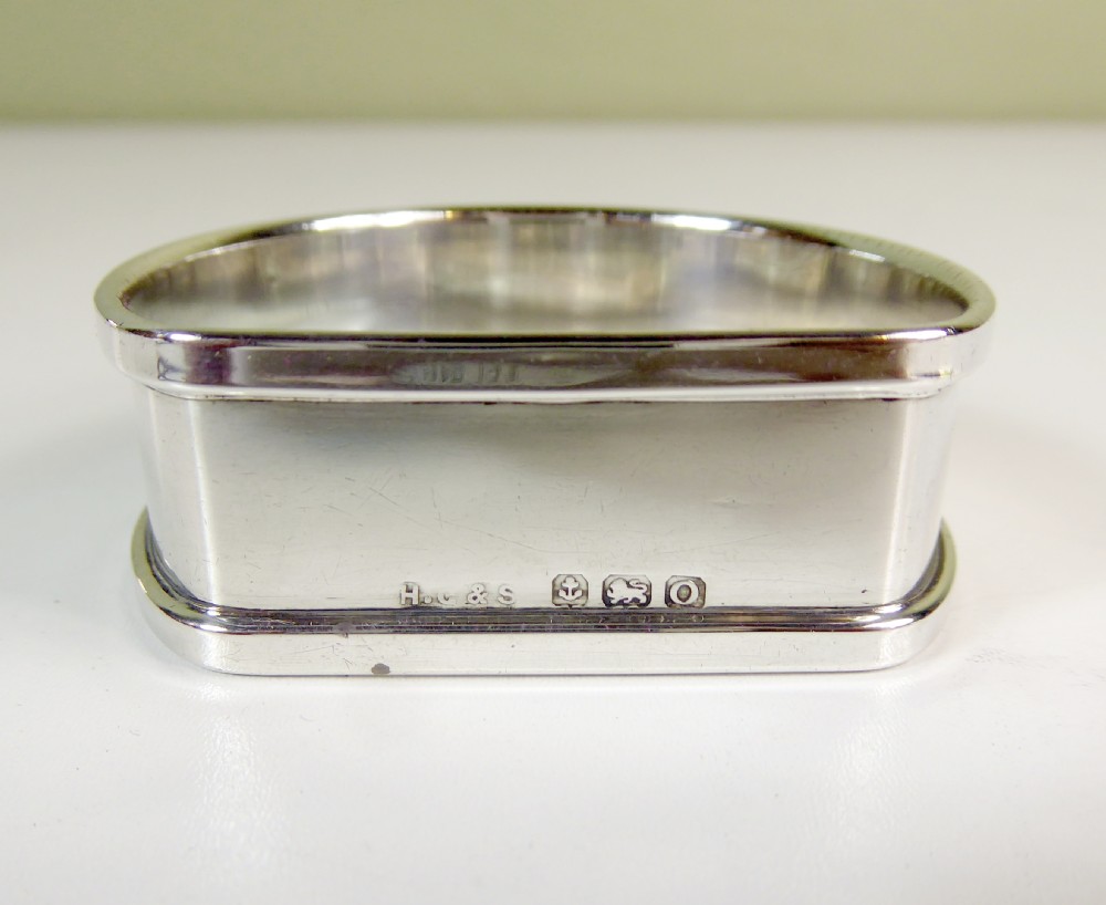 A BOXED SET OF SOLID SILVER NAPKIN RINGS View IV