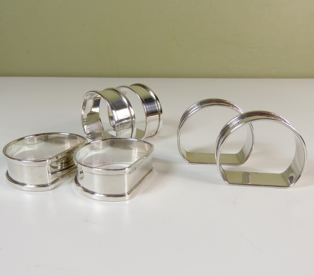 A BOXED SET OF SOLID SILVER NAPKIN RINGS View V