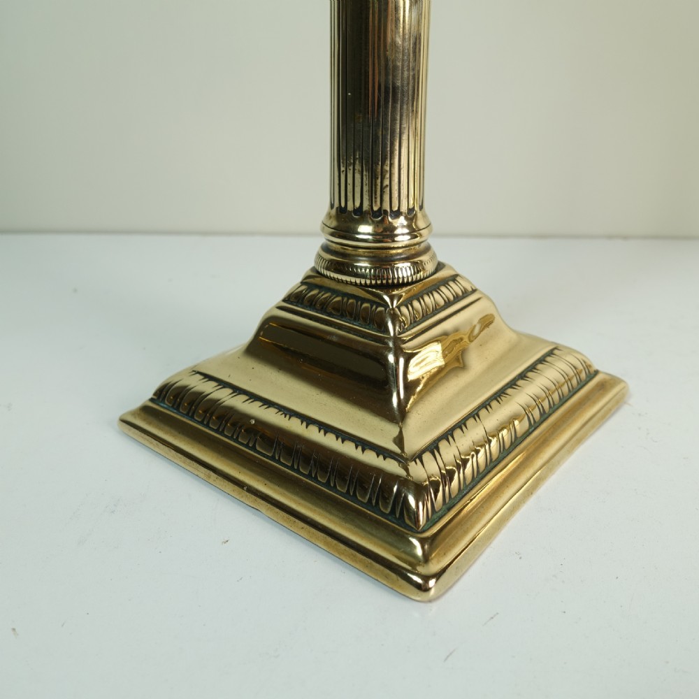 PAIR OF GEORGE III BRASS CANDLESTICKS View II