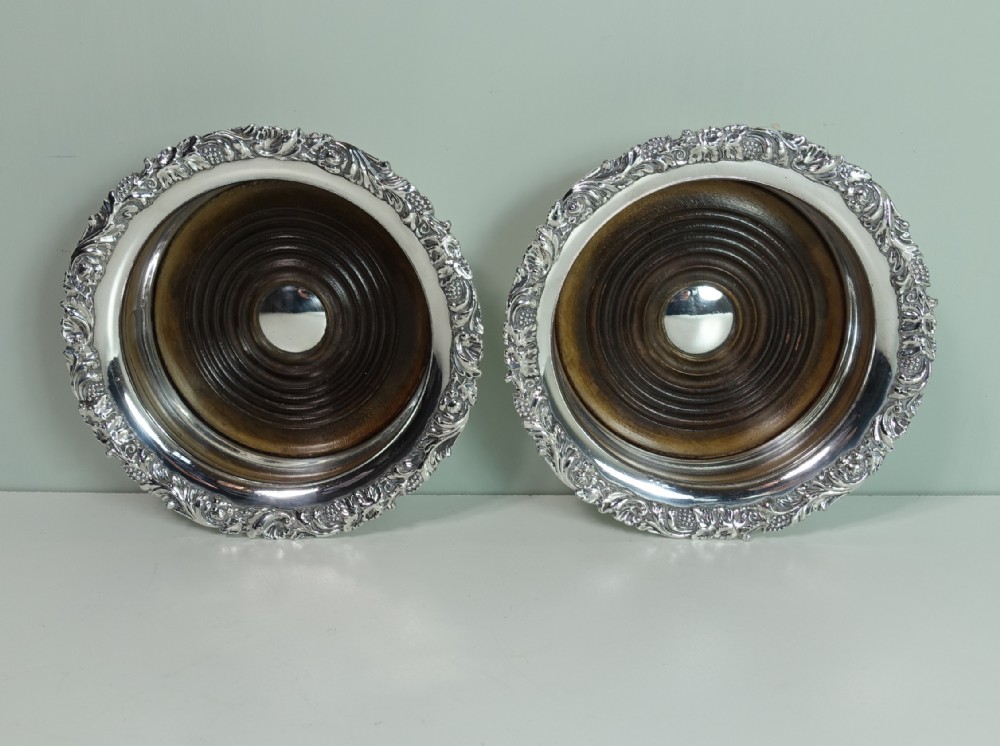 PAIR OF 19TH C SILVER PLATED BOTTLE COASTERS