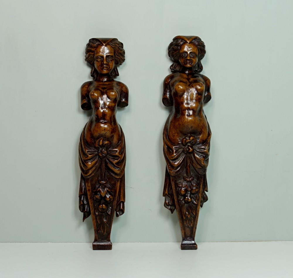 PAIR OF 17TH C WALNUT TERM FIGURES