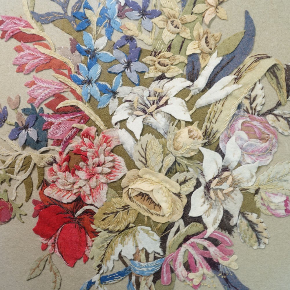 An early nineteenth-century oval gilt-framed textile picture depicting a hand-stitched bouquet of flowers using felt and wool. View III