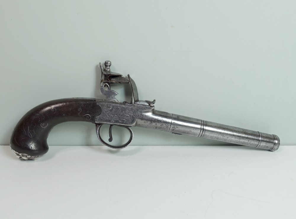 18TH C FLINTLOCK PISTOL WITH MASK DECORATION