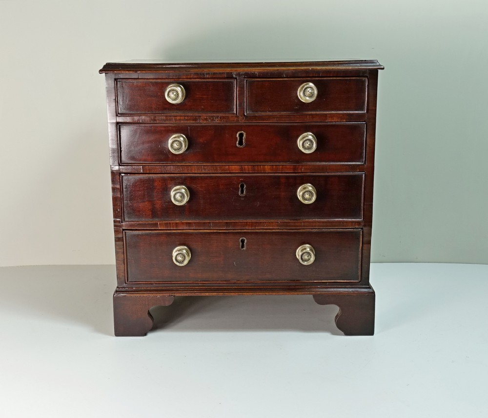 MINIATURE MAHOGANY CHEST OF DRAWERS C 1800