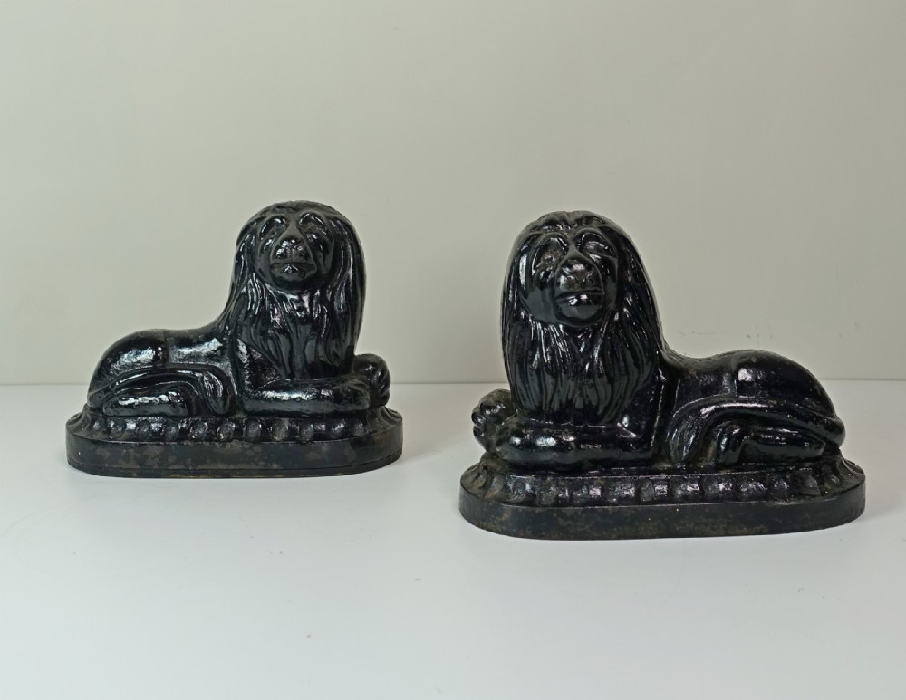 PAIR OF 19TH C LION DOOR STOPS