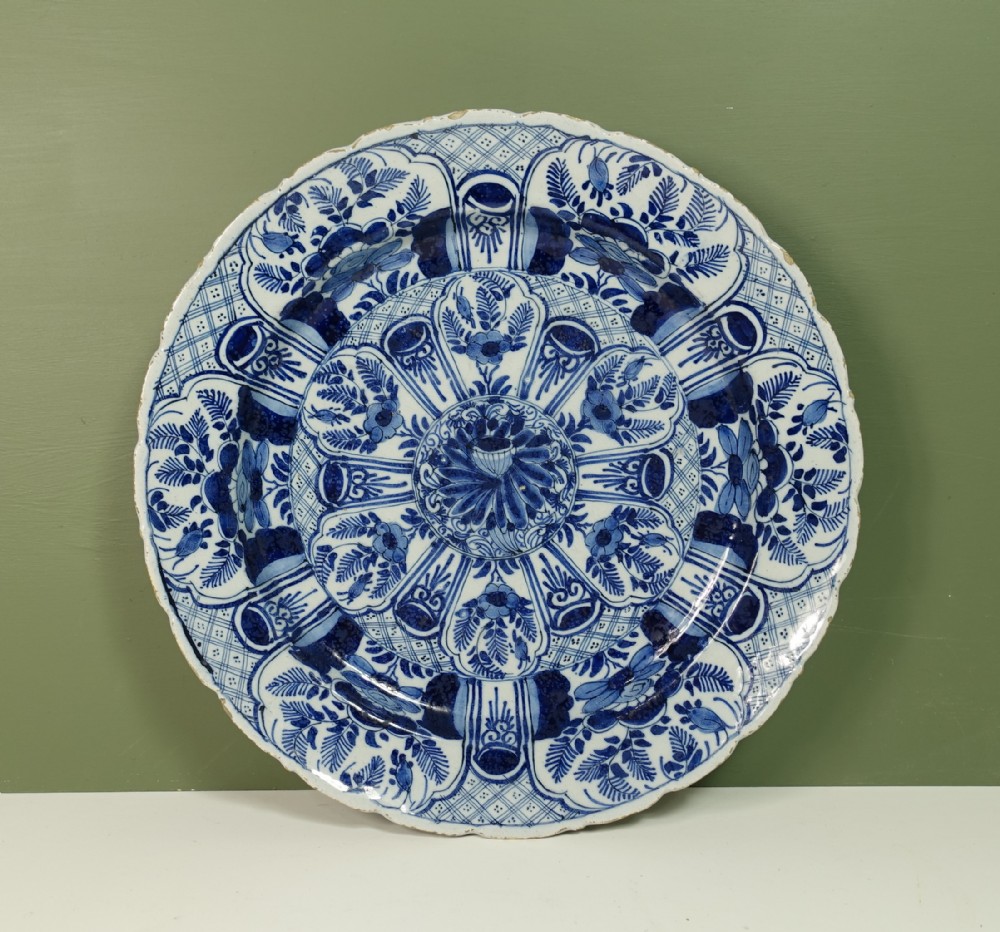 18TH C EXUBERANTLY DECORATED DELFT CHARGER