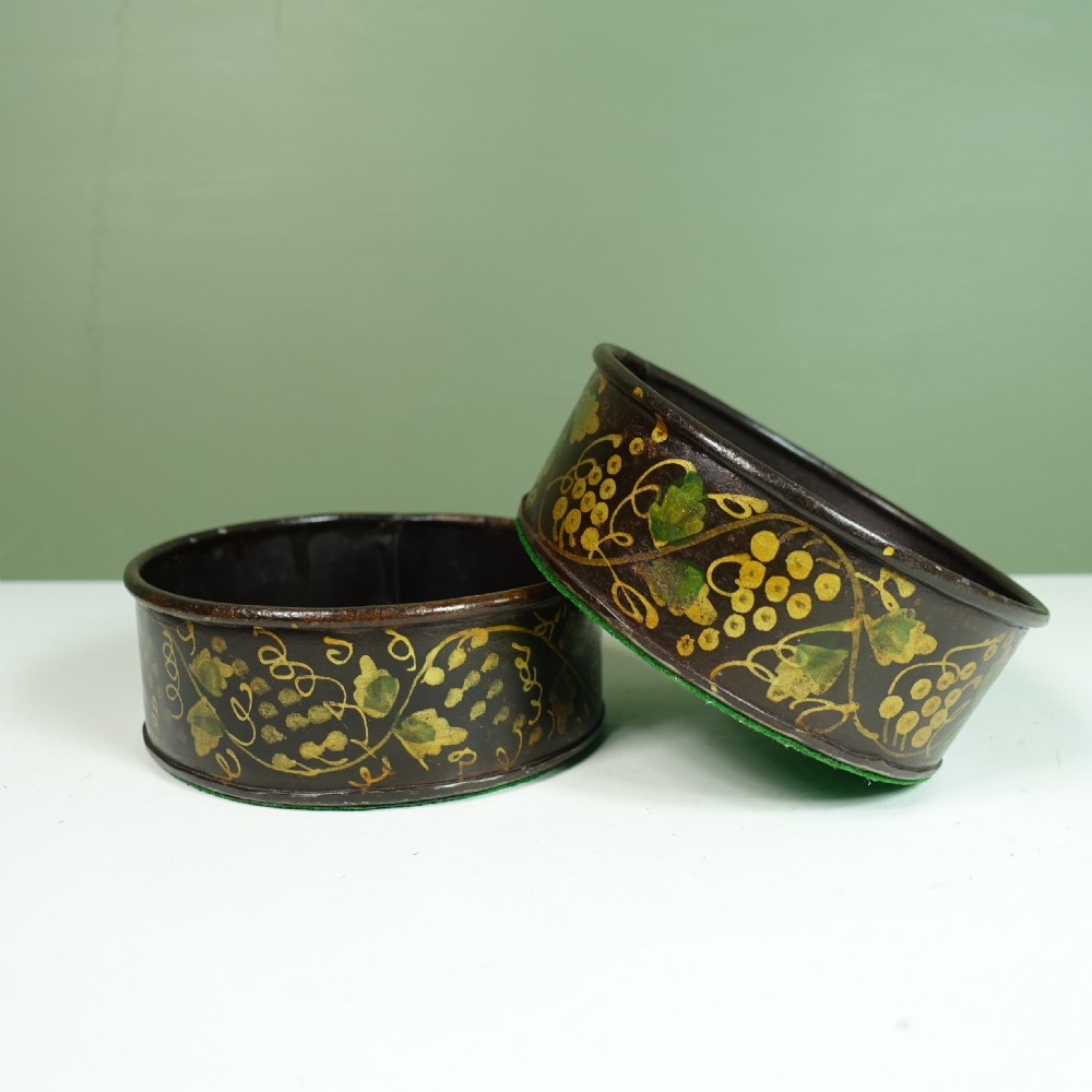 PAIR OF 19TH C TOLE WINE BOTTLE COASTERS