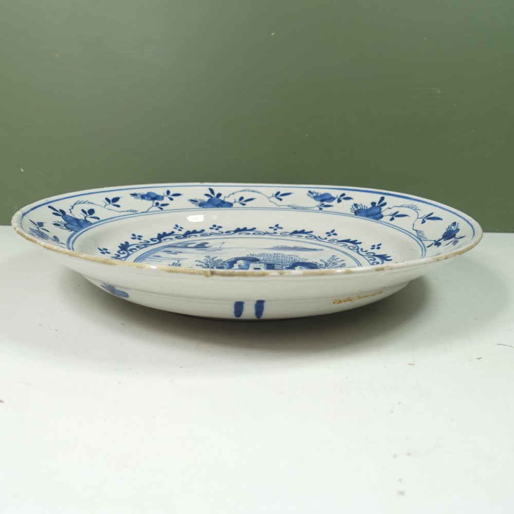 18TH C DELFT CHARGER WITH A LAKE SCENE View IV