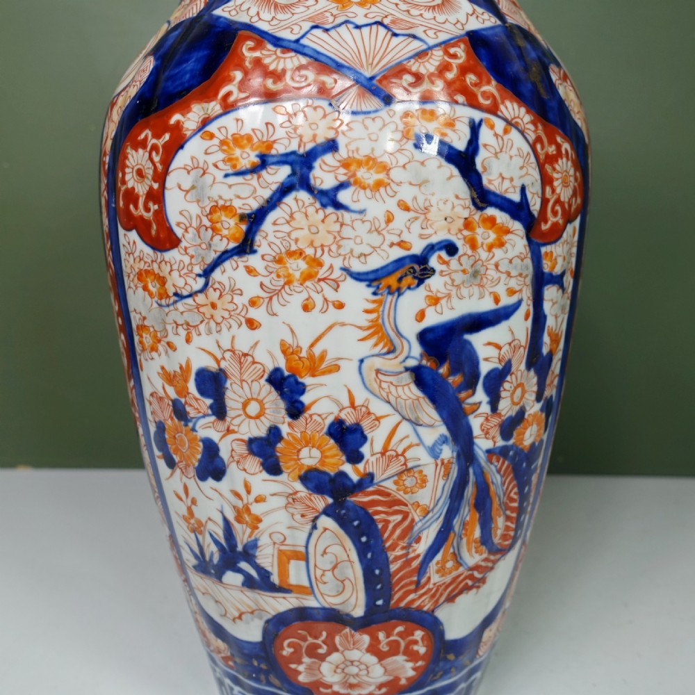 A Japanese Imari porcelain vase featuring hand-painted floral panels, phoenix motifs, cobalt blue underglaze, and iron-red enamelling. View II