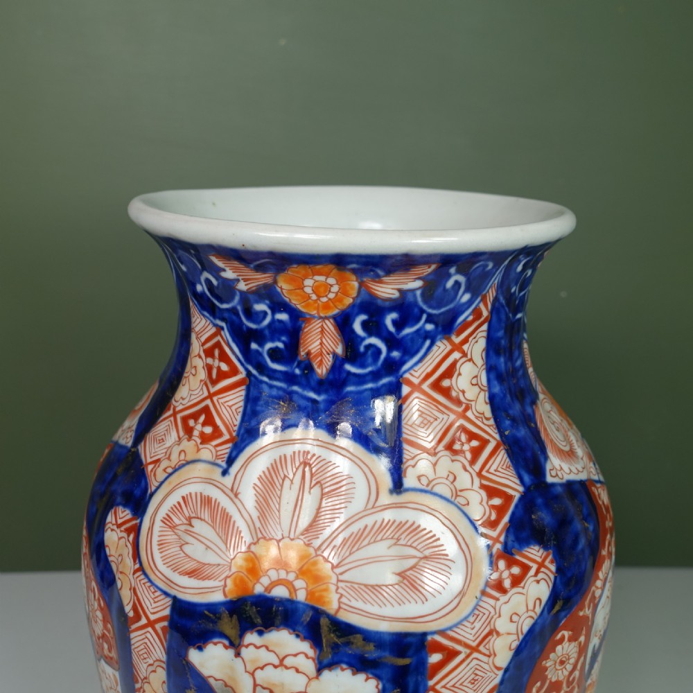 A Japanese Imari porcelain vase featuring hand-painted floral panels, phoenix motifs, cobalt blue underglaze, and iron-red enamelling. View VI