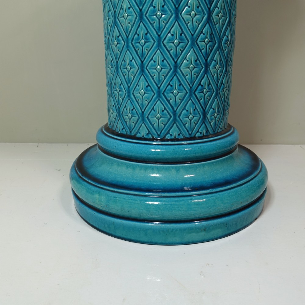 A cylindrical Victorian turquoise glazed ceramic conservatory seat featuring a relief diamond lattice pattern on the central column and a moulded stepped base. View IV
