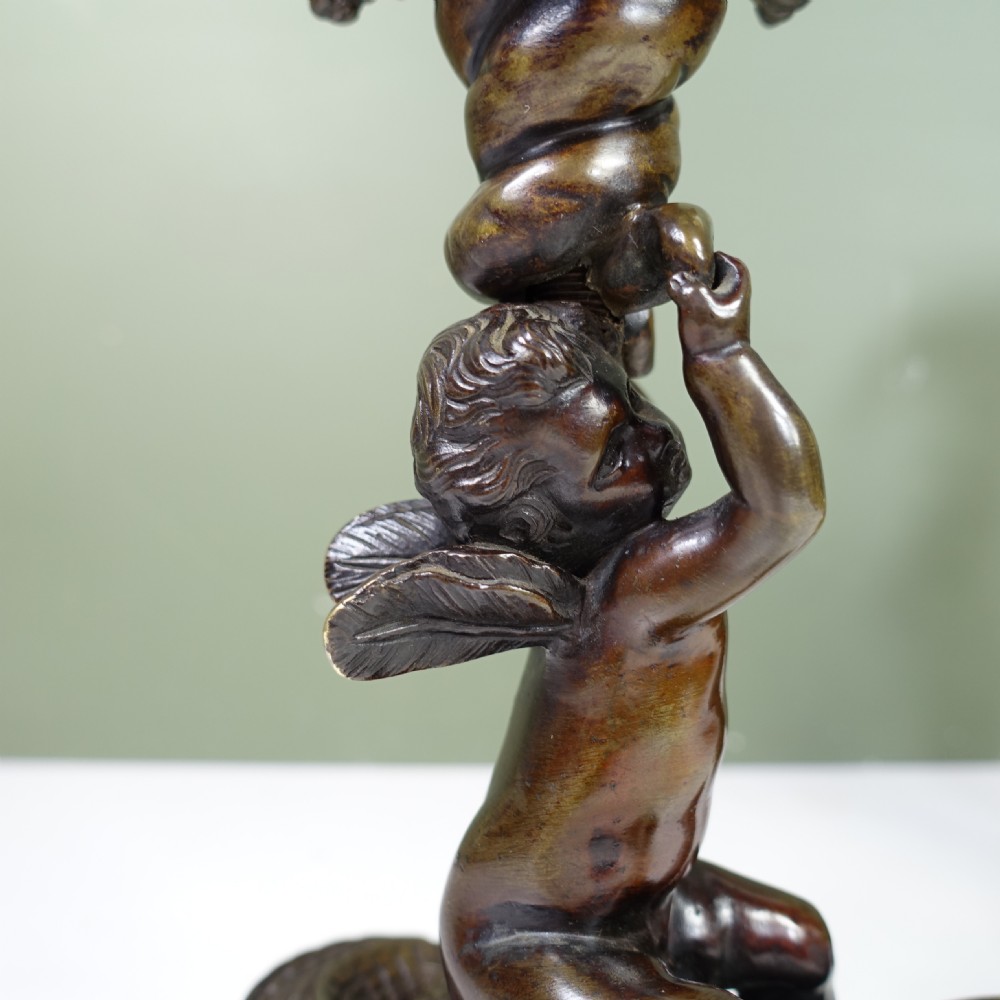 PAIR OF REGENCY BRONZE CANDLESTICKS OF CHERUBS ON CROCODILES View V