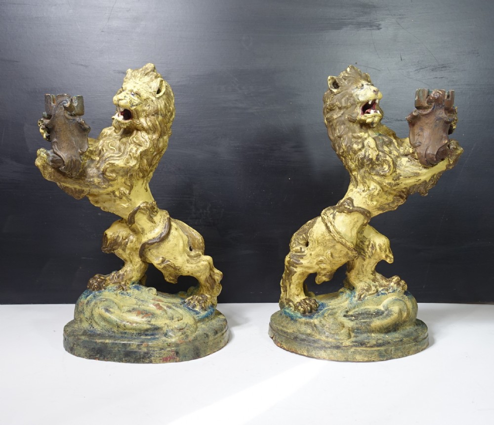 PAIR OF 19TH C TERRACOTTA LIONS