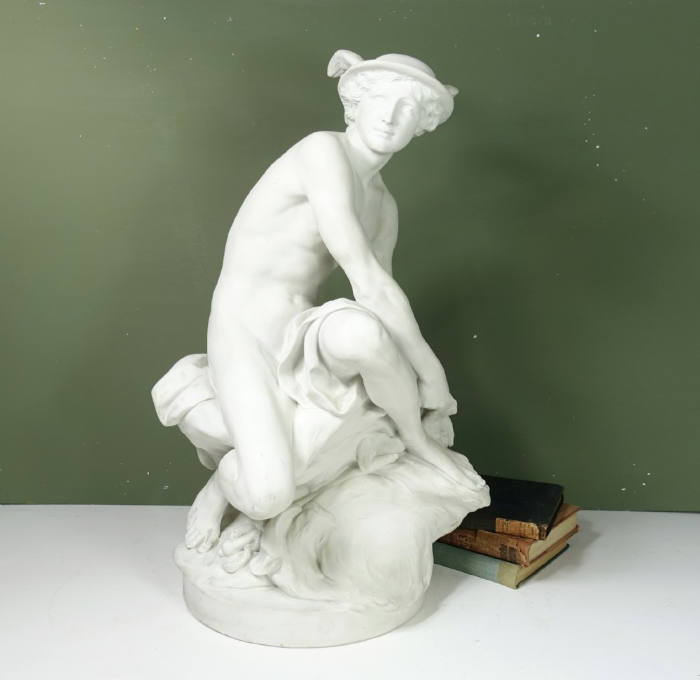 PORCELAIN FIGURE OF A YOUNG MERCURY