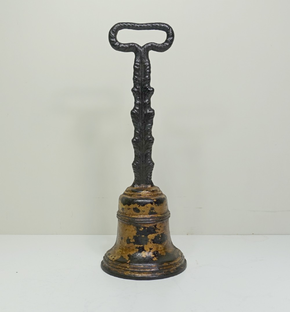19TH C CAST IRON DOOR PORTER, DOOR STOP