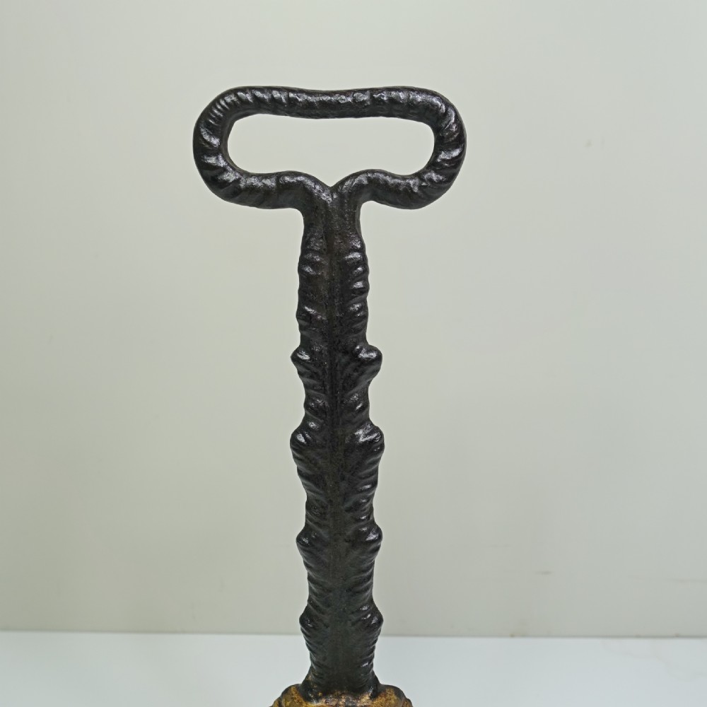 19TH C CAST IRON DOOR PORTER, DOOR STOP View V