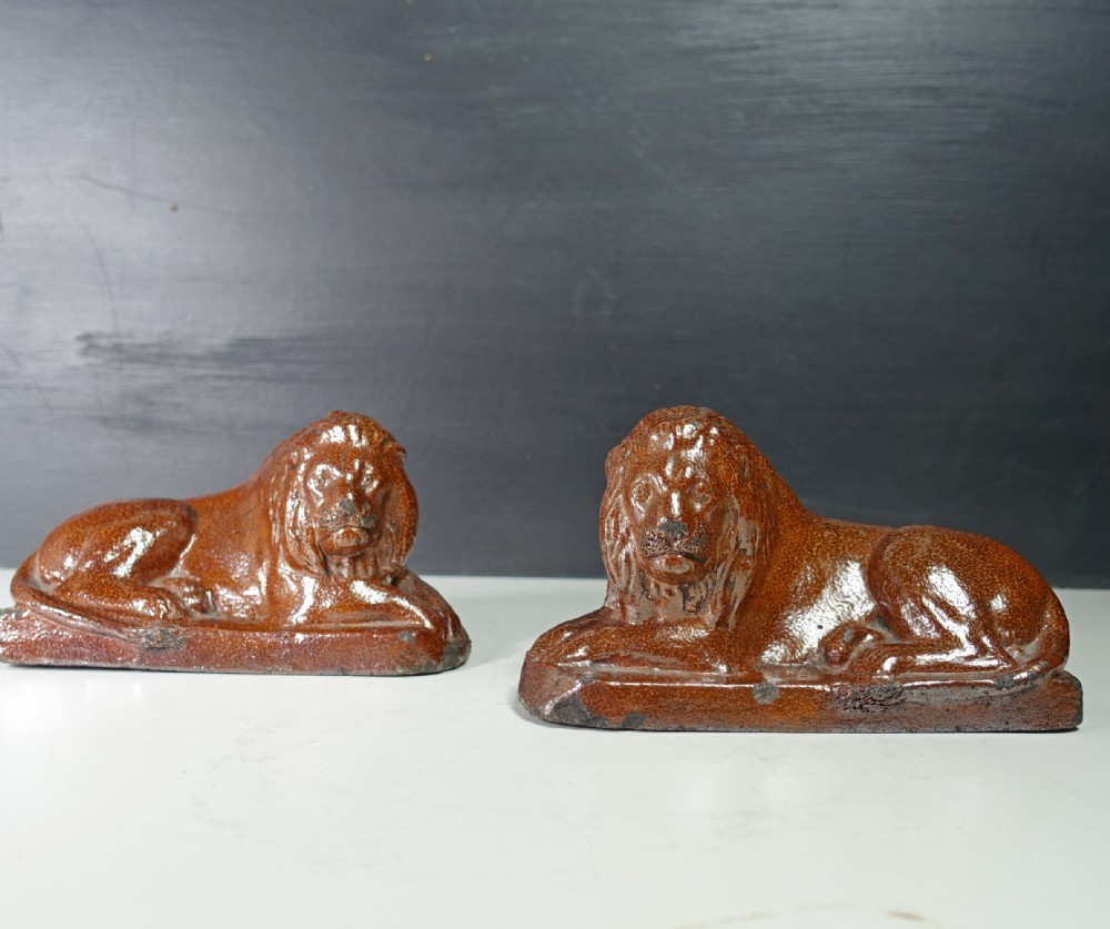 PAIR OF 19TH C SALT GLAZED LIONS