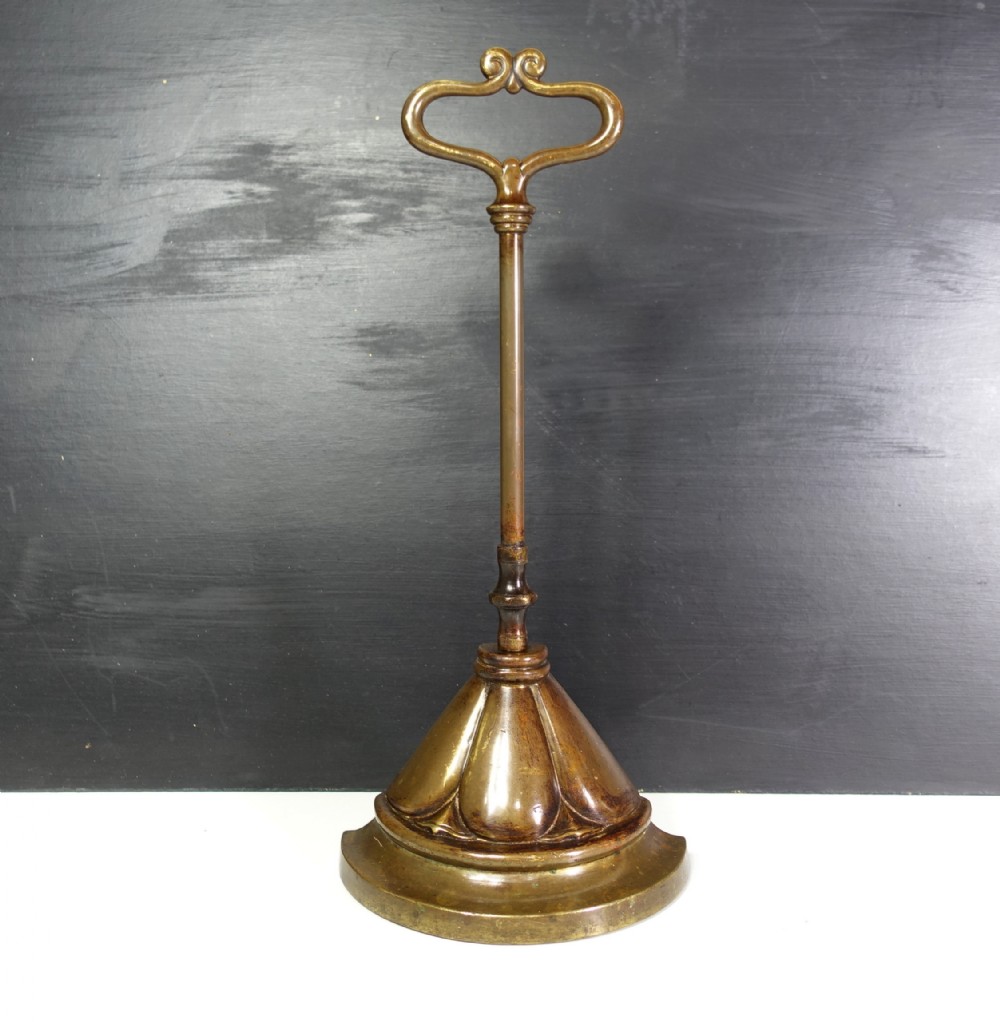 19TH C BRASS DOOR PORTER, DOOR STOP
