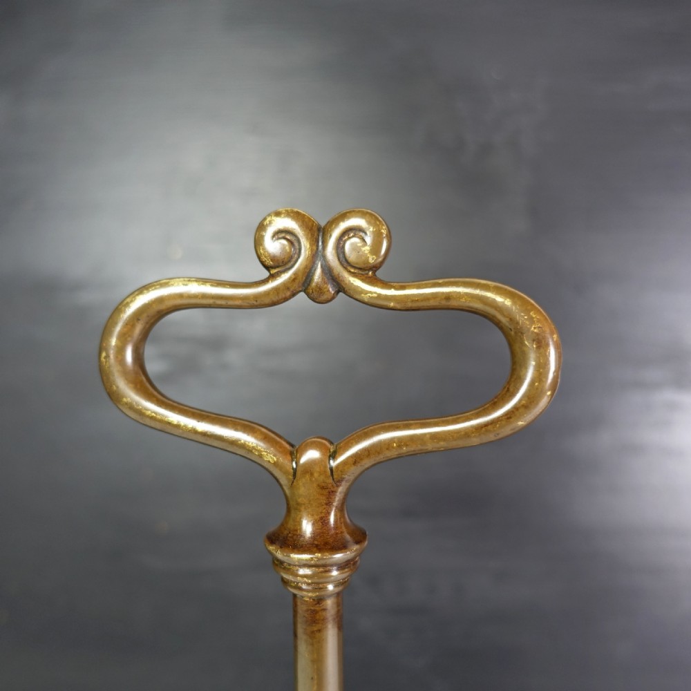 19TH C BRASS DOOR PORTER, DOOR STOP View IV