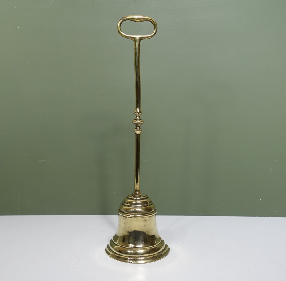19TH C BRASS DOOR PORTER, DOOR STOP