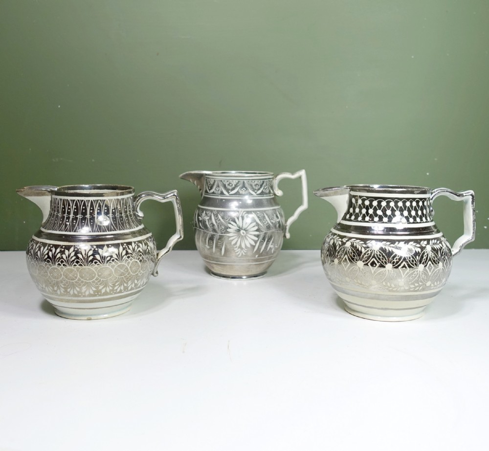 THREE EARLY 19TH C SILVER LUSTRE JUGS