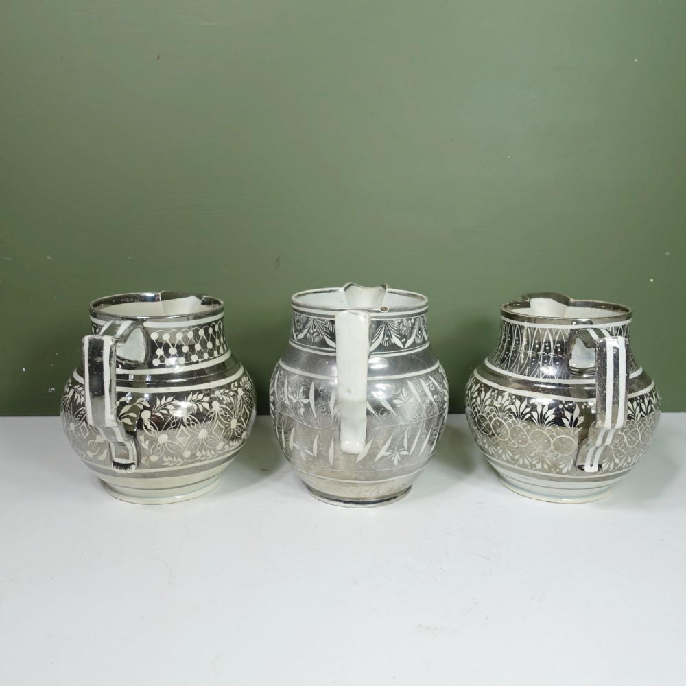 THREE EARLY 19TH C SILVER LUSTRE JUGS View VI
