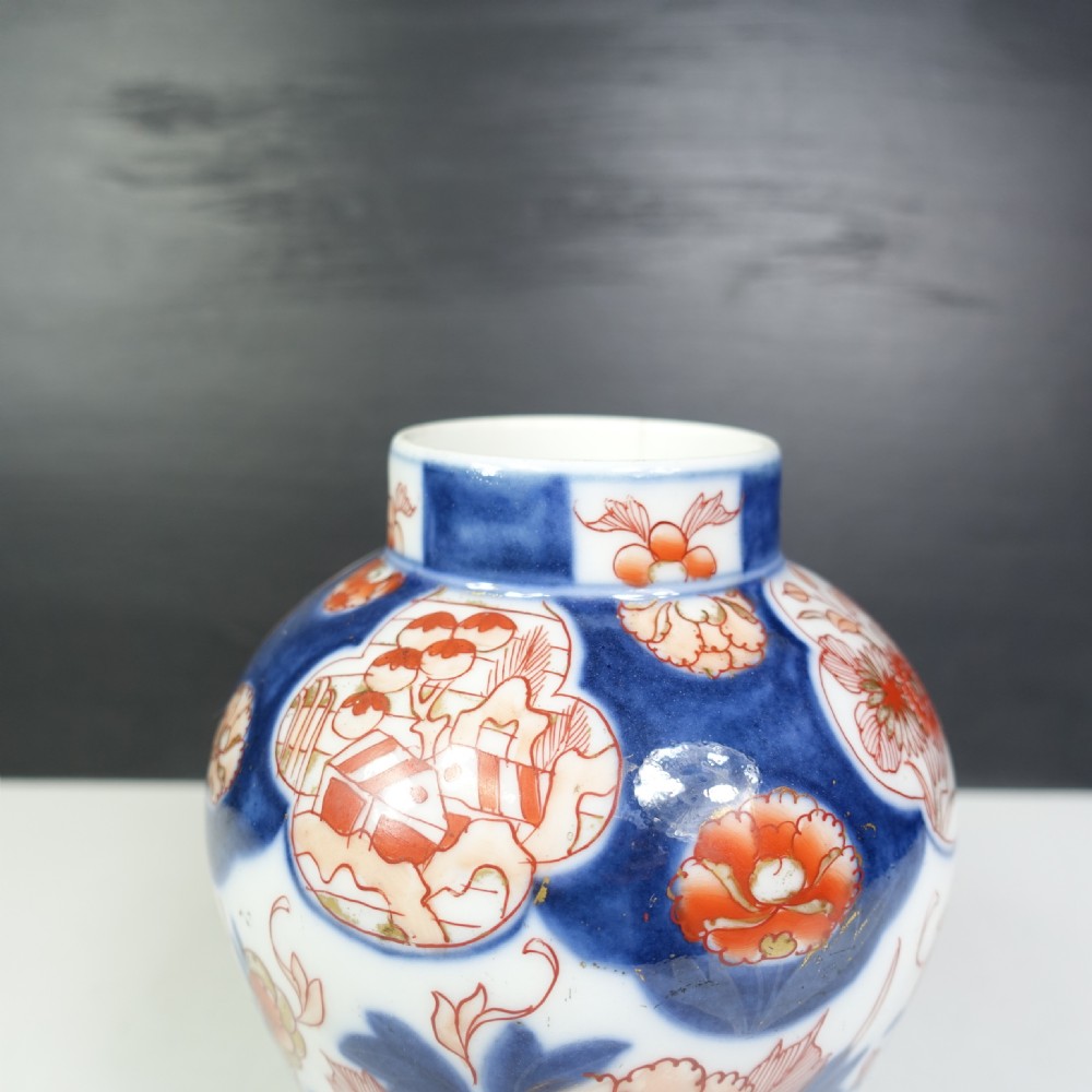 A 19th-century Japanese Imari porcelain vase featuring hand-painted floral motifs and landscape cartouches in cobalt blue, iron-red, and orange enamels. View VII